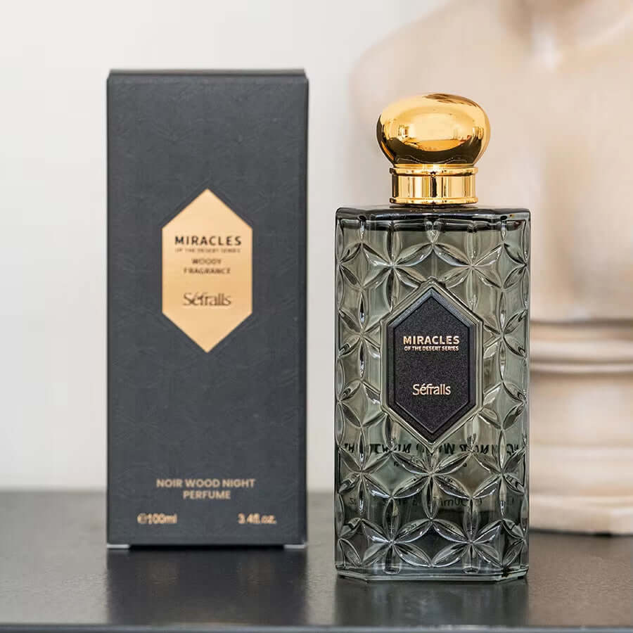 Sefralls Noir Wood Night Perfume 100ml bottle with elegant design next to its packaging, showcasing woody fragrance.