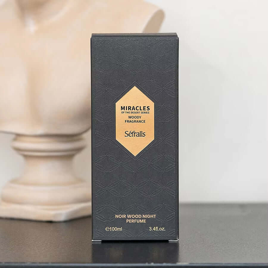 Sefralls Noir Wood Night Perfume 100ml packaging displayed on a table with a decorative bust in the background.