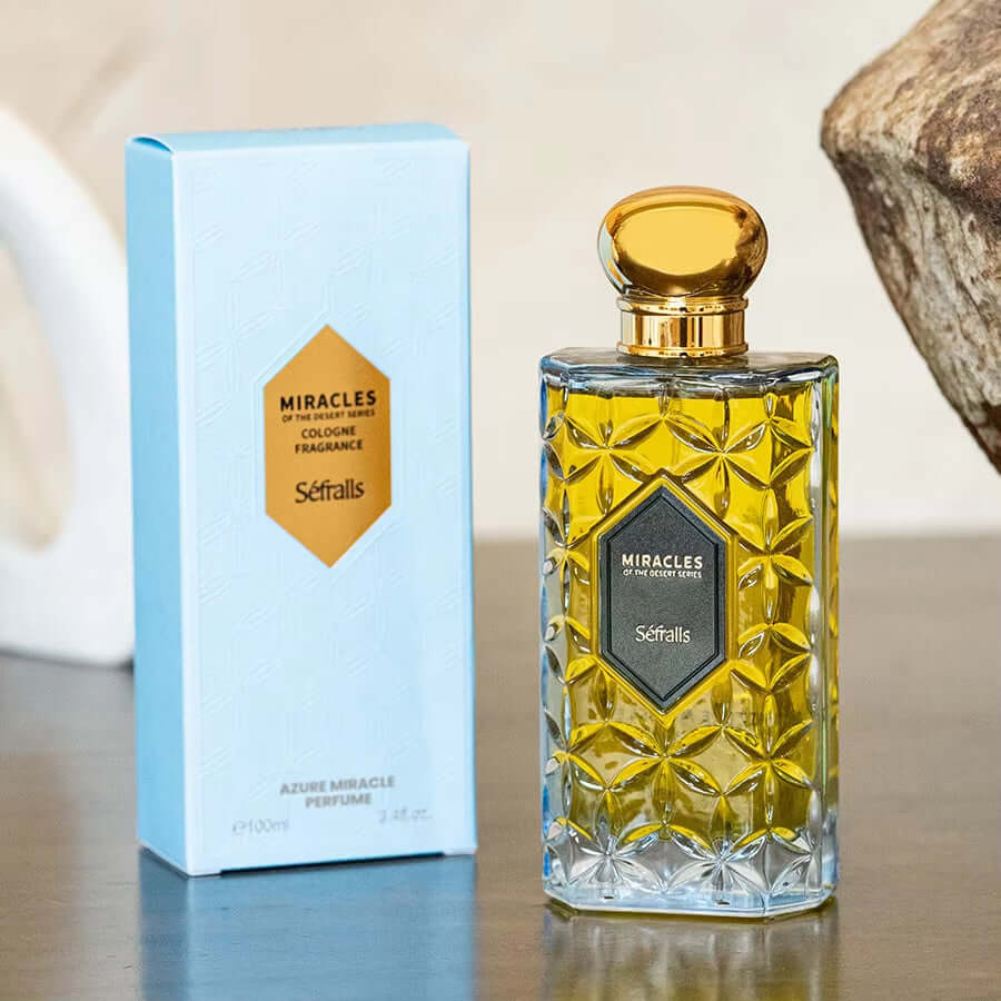 Sefralls Azure Miracle Perfume Cologne Fragrance with elegant glass bottle and blue packaging on a wooden table.